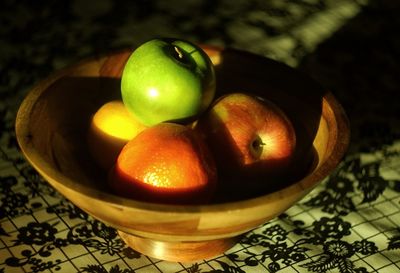 Close-up of fruits in bowl on table