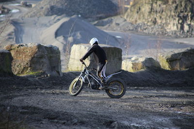 Man riding bicycle on mountain