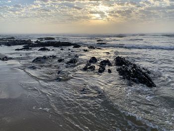 Scenic view of sea against sky during sunset