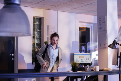 Portrait of young woman standing in gym