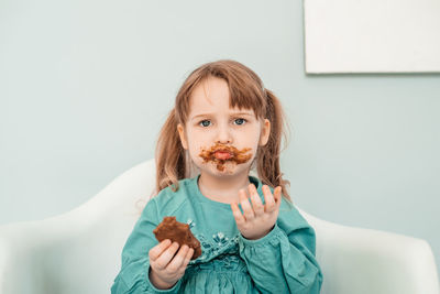 Portrait of boy eating food