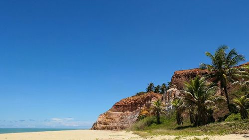 Scenic view of sea against clear blue sky