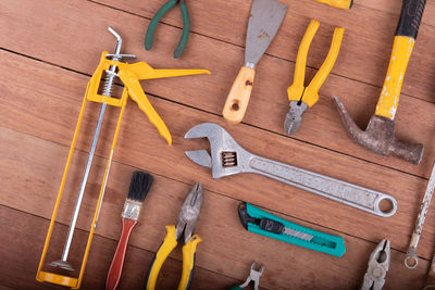 High angle view of tools on wooden floor