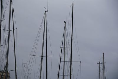 Low angle view of sailboat in sea against sky