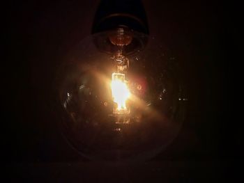 Close-up of illuminated light bulb