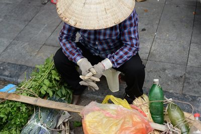 High angle view of woman preparing food at market