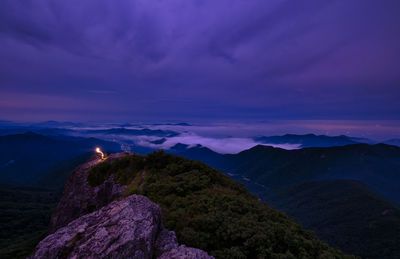 Scenic view of mountains against the sky at sunrise