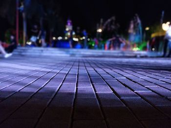 Surface level of footpath in city at night