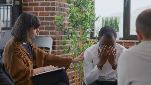 Therapist talking with patient at centre