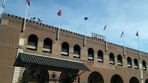 Low angle view of flag against sky