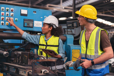 Rear view of construction worker working at factory