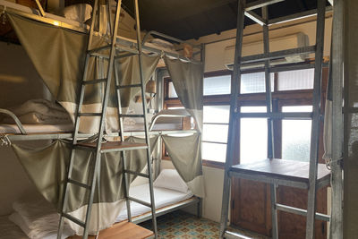 Empty chairs and tables in building