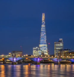 Illuminated buildings in city at night