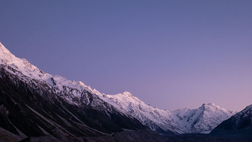 Mountain range with snowy peaks shot during sunrise,made in aoraki mt cook national park,new zealand