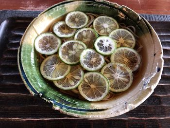 High angle view of fruits in plate on table