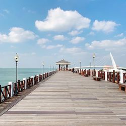 View of pier on sea against sky