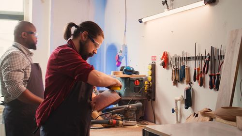 Rear view of man working at home