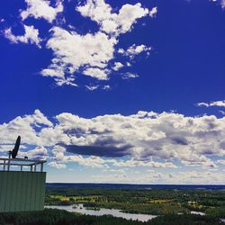 Scenic view of landscape against blue sky