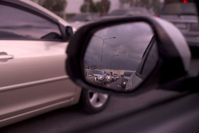 Reflection of car on side-view mirror