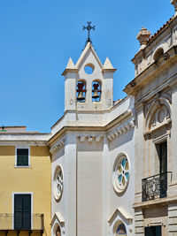 Side tower of the church with two bells in mahon, menorca, spain