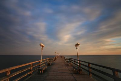 Pier over sea against sky