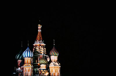 Illuminated building against sky at night