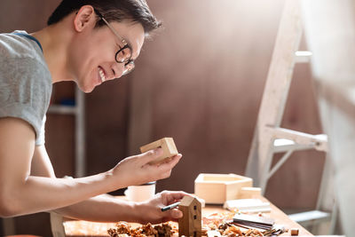 Close-up of carpenter working in workshop