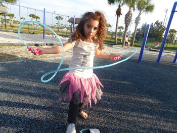 Girl playing on slide at playground