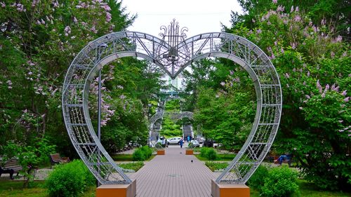 Gazebo by trees against sky