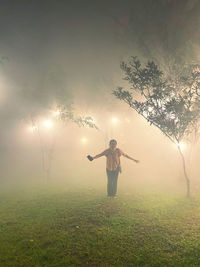 Digital composite image of man standing on field