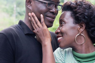 Young couple embracing each other in the bush.