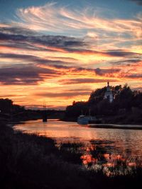 Scenic view of river at sunset