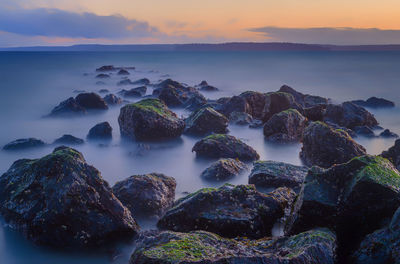 Scenic view of sea against sky during sunset