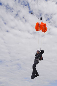 Skydiver with chute opening mid-air