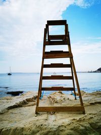 Built structure on beach against sky