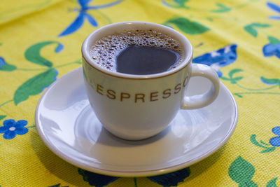 High angle view of coffee cup on table