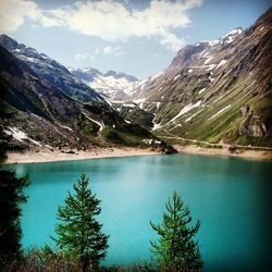 Scenic view of lake with mountains in background