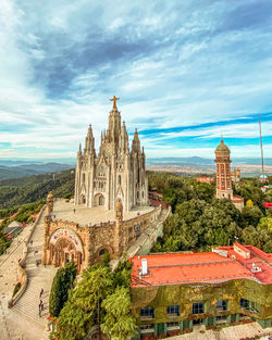 Panoramic view of temple building against sky in city