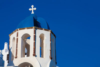 Traditional architecture of the churches of the oia city in santorini island