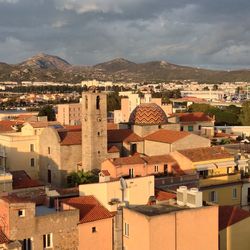 High angle view of houses in town against sky