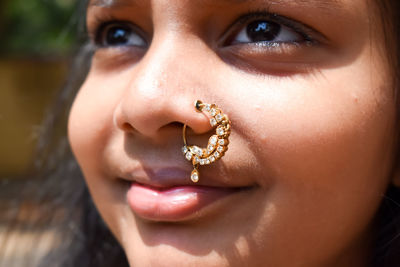 Close-up portrait of girl wearing nose ring