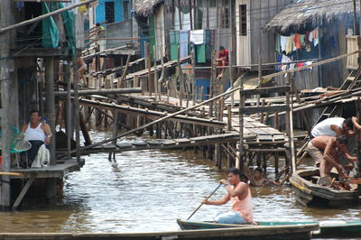 People in boat at canal