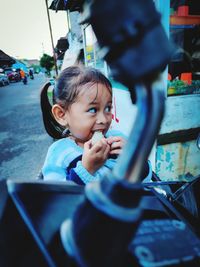 Portrait of cute girl looking away