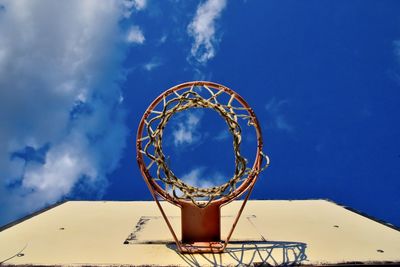 Low angle view of basketball hoop against sky