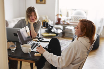 Women using laptop at home