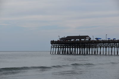 Pier over sea against sky