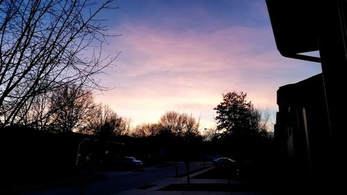 Silhouette trees against sky during sunset