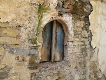 Low angle view of weathered wall of old building