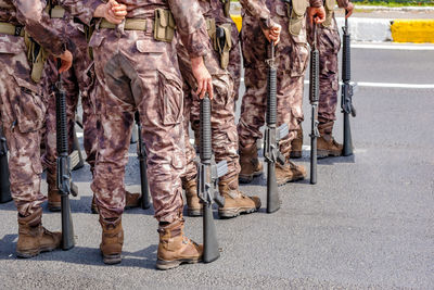 Low section of soldiers standing on road