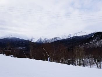 Scenic view of mountains against sky during winter